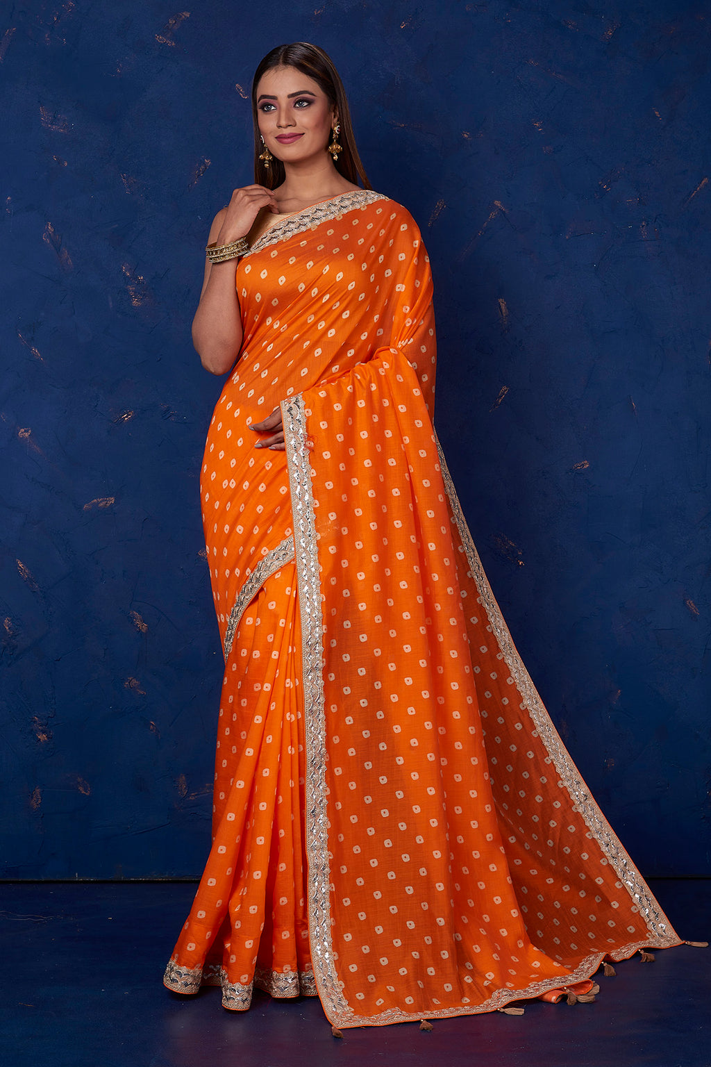 Buy beautiful orange bandhej chanderi saree online in USA with embroidered border. Keep your ethnic wardrobe up to date with latest designer sarees, pure silk sarees, handwoven sarees, tussar silk sarees, embroidered sarees from Pure Elegance Indian saree store in USA.-full view