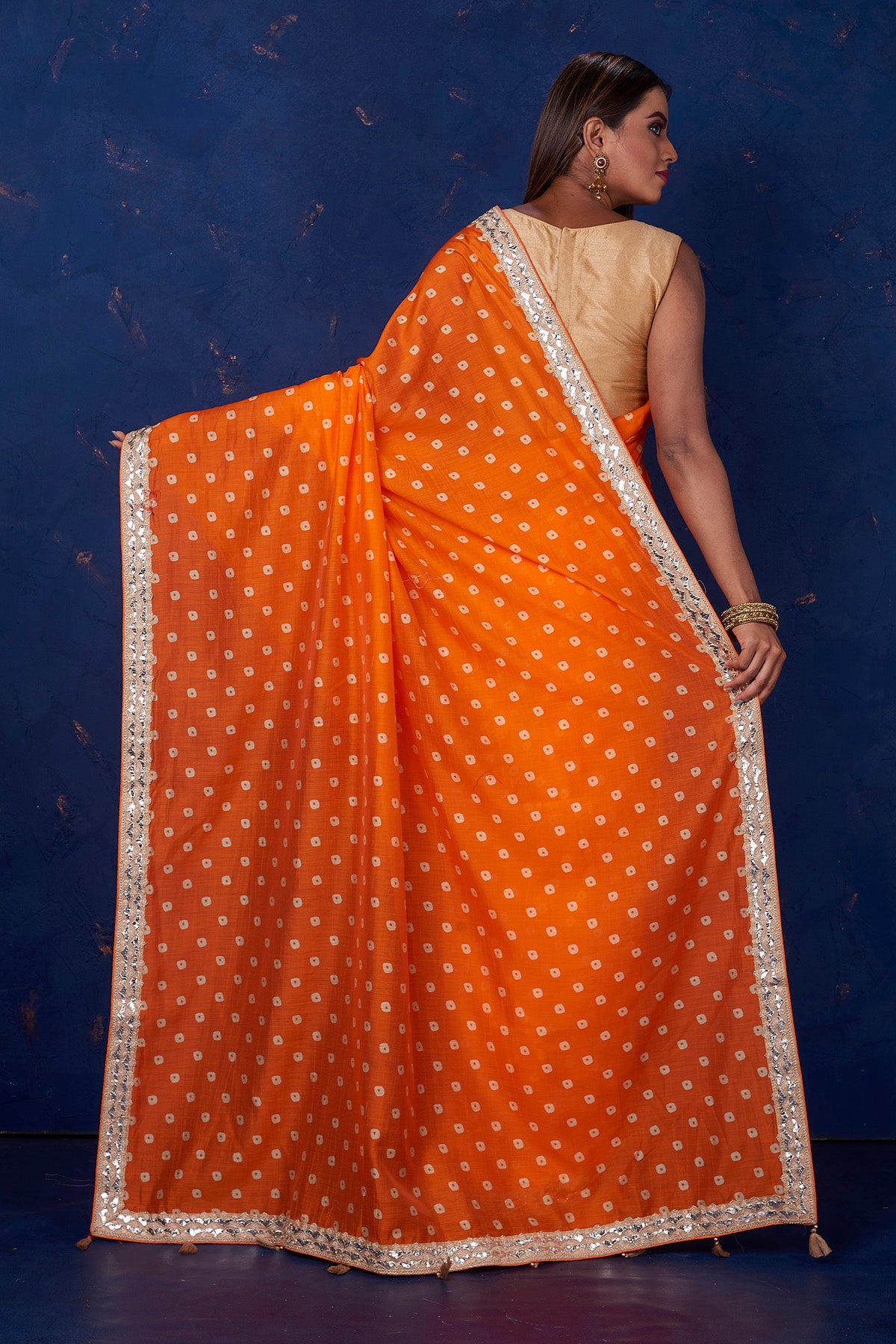 Buy beautiful orange bandhej chanderi saree online in USA with embroidered border. Keep your ethnic wardrobe up to date with latest designer sarees, pure silk sarees, handwoven sarees, tussar silk sarees, embroidered sarees from Pure Elegance Indian saree store in USA.-back