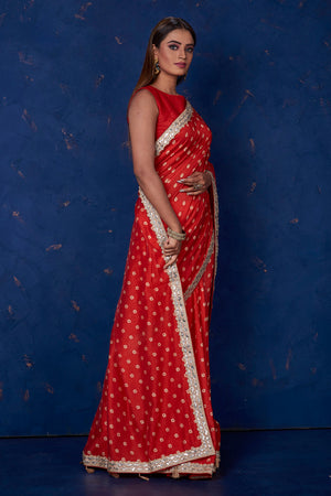 Shop beautiful red bandhej chanderi sari online in USA with embroidered border. Keep your ethnic wardrobe up to date with latest designer sarees, pure silk sarees, handwoven sarees, tussar silk sarees, embroidered sarees from Pure Elegance Indian saree store in USA.-side