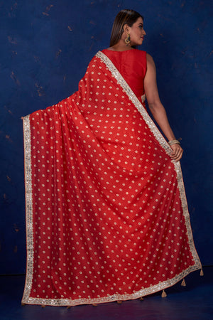 Shop beautiful red bandhej chanderi sari online in USA with embroidered border. Keep your ethnic wardrobe up to date with latest designer sarees, pure silk sarees, handwoven sarees, tussar silk sarees, embroidered sarees from Pure Elegance Indian saree store in USA.-back