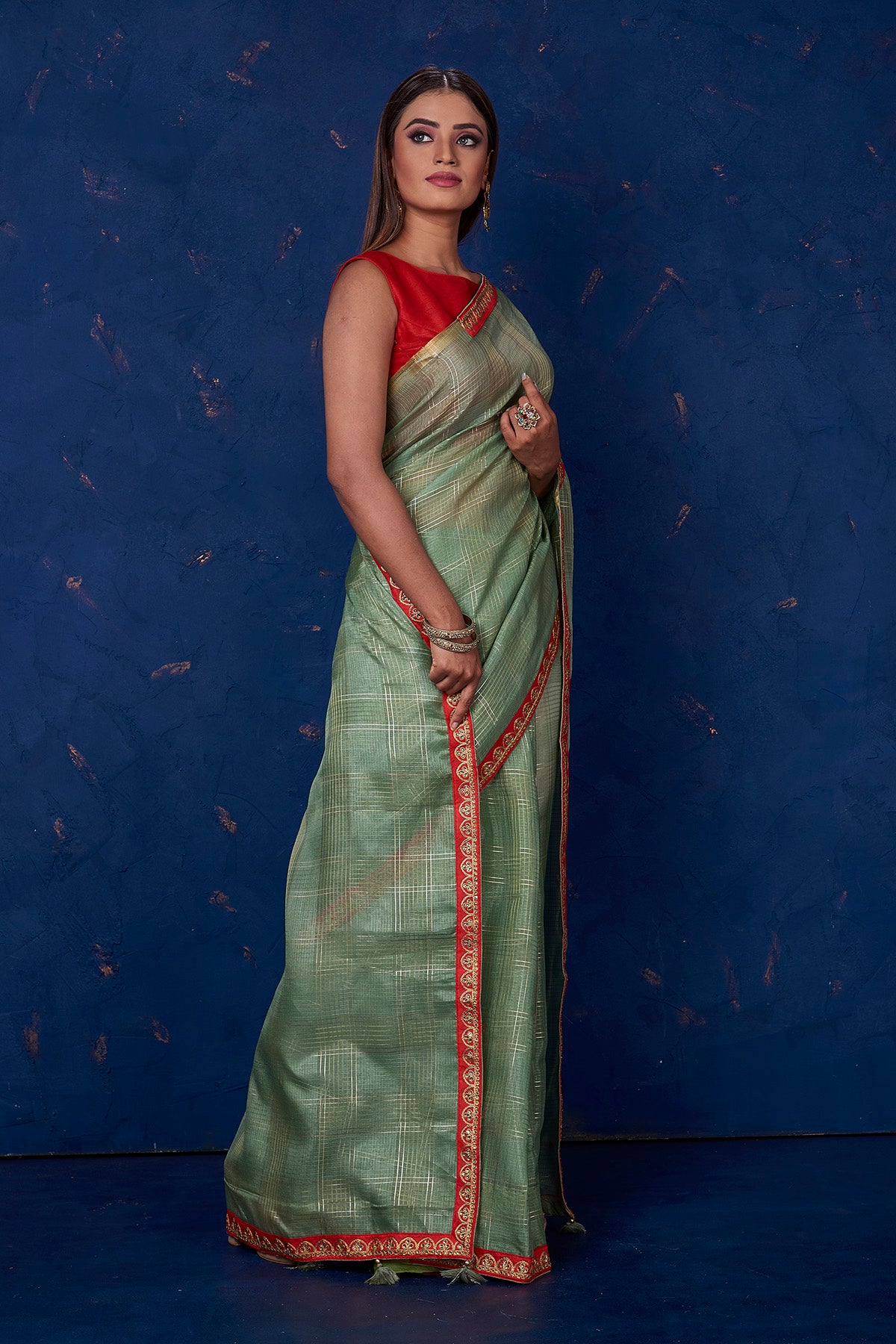 Buy stunning sage green self-check chanderi sari online in USA with embroidered border. Keep your ethnic wardrobe up to date with latest designer sarees, pure silk sarees, handwoven sarees, tussar silk sarees, embroidered sarees from Pure Elegance Indian saree store in USA.-side