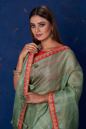 Buy stunning sage green self-check chanderi sari online in USA with embroidered border. Keep your ethnic wardrobe up to date with latest designer sarees, pure silk sarees, handwoven sarees, tussar silk sarees, embroidered sarees from Pure Elegance Indian saree store in USA.-closeup