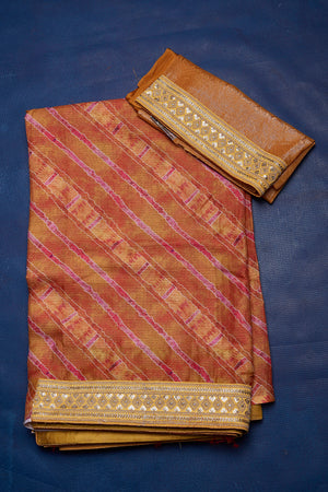 Buy beautiful brown printed Kota saree online in USA with embroidered border. Keep your ethnic wardrobe up to date with latest designer sarees, pure silk sarees, handwoven sarees, tussar silk sarees, embroidered sarees from Pure Elegance Indian saree store in USA.-blouse