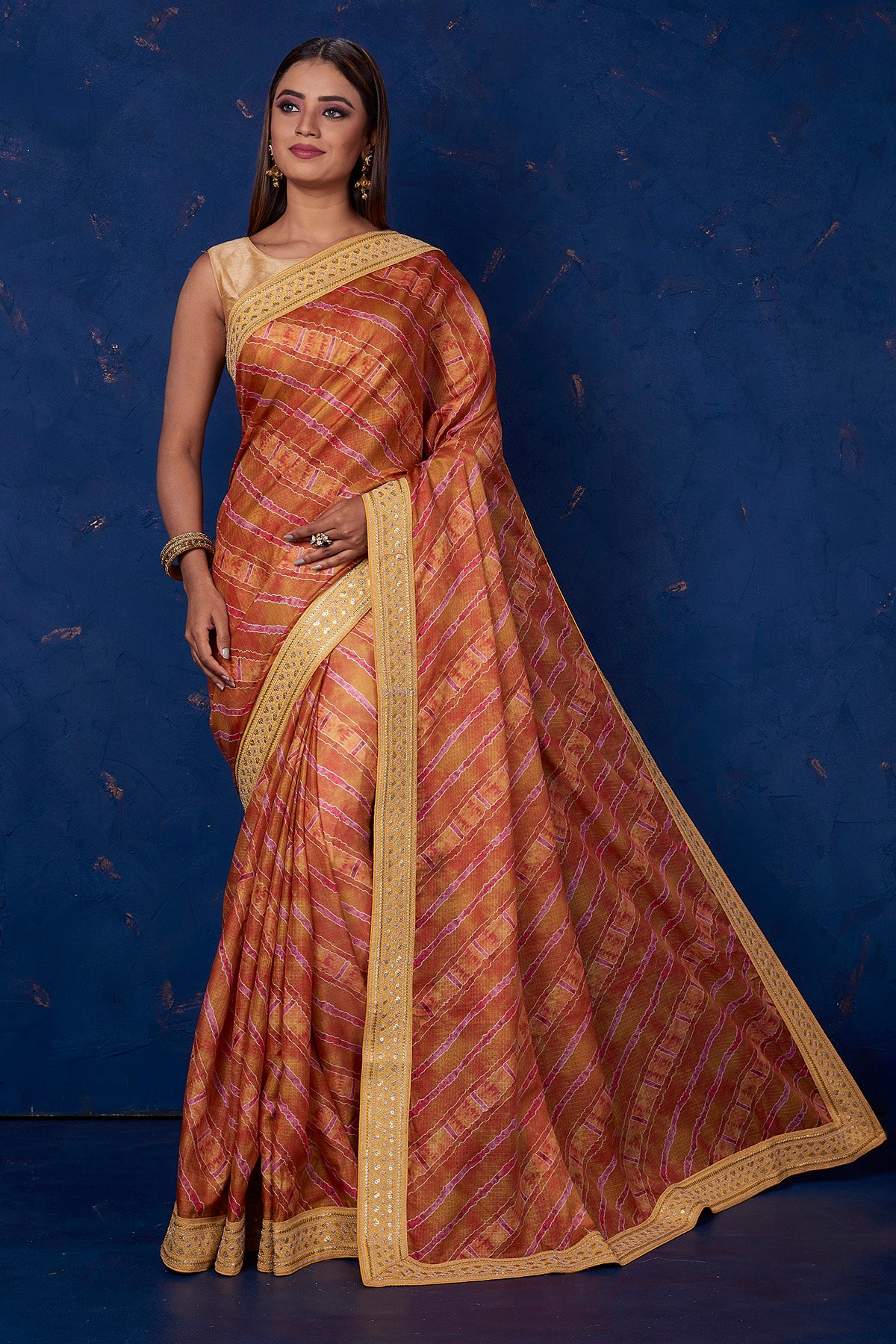 Buy beautiful brown printed Kota saree online in USA with embroidered border. Keep your ethnic wardrobe up to date with latest designer sarees, pure silk sarees, handwoven sarees, tussar silk sarees, embroidered sarees from Pure Elegance Indian saree store in USA.-full view