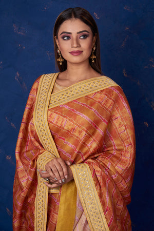 Buy beautiful brown printed Kota saree online in USA with embroidered border. Keep your ethnic wardrobe up to date with latest designer sarees, pure silk sarees, handwoven sarees, tussar silk sarees, embroidered sarees from Pure Elegance Indian saree store in USA.-closeup