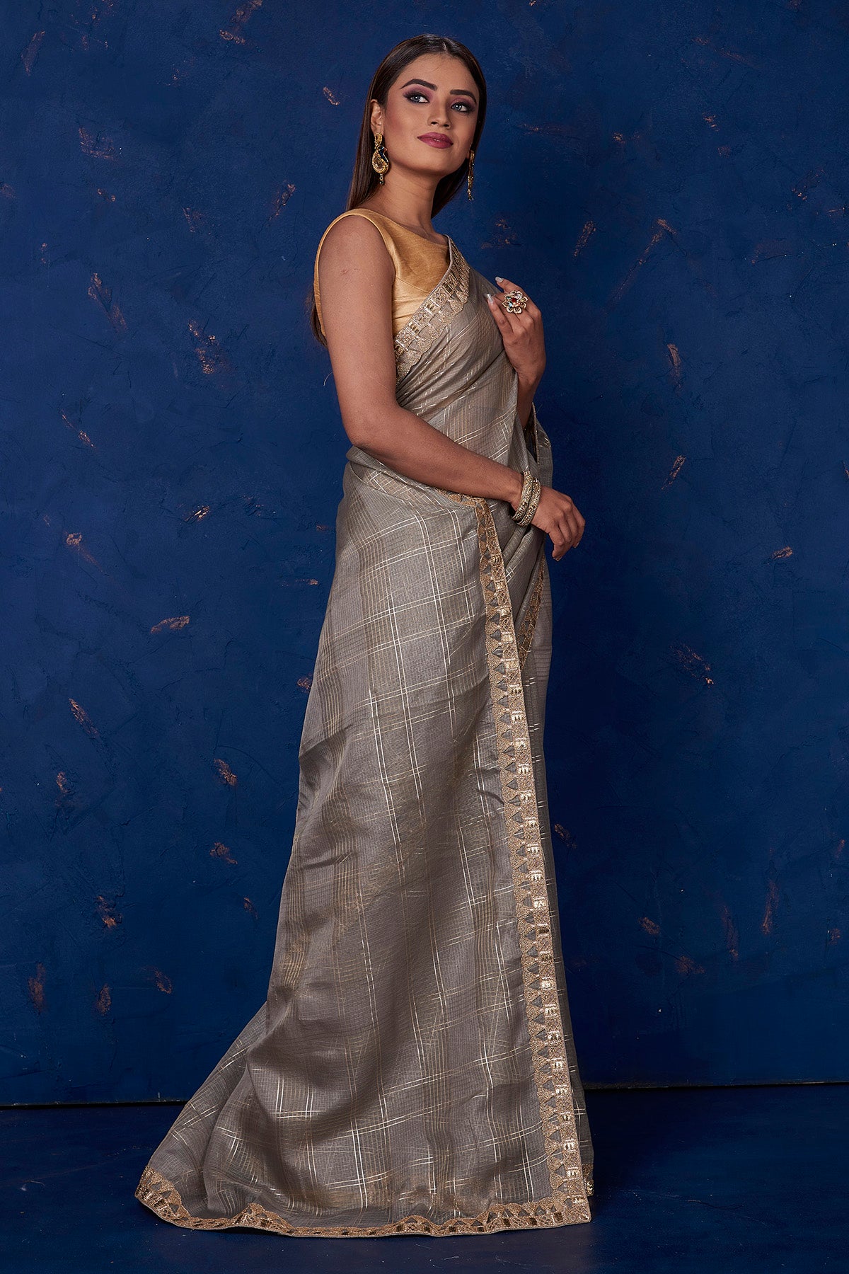 Shop stunning grey Kota check saree online in USA with embroidered border. Keep your ethnic wardrobe up to date with latest designer sarees, pure silk sarees, handwoven sarees, tussar silk sarees, embroidered sarees from Pure Elegance Indian saree store in USA.-side
