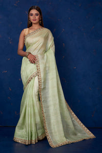 Shop beautiful pista green Kota check saree online in USA with embroidered border. Keep your ethnic wardrobe up to date with latest designer sarees, pure silk sarees, handwoven sarees, tussar silk sarees, embroidered sarees from Pure Elegance Indian saree store in USA.-full view