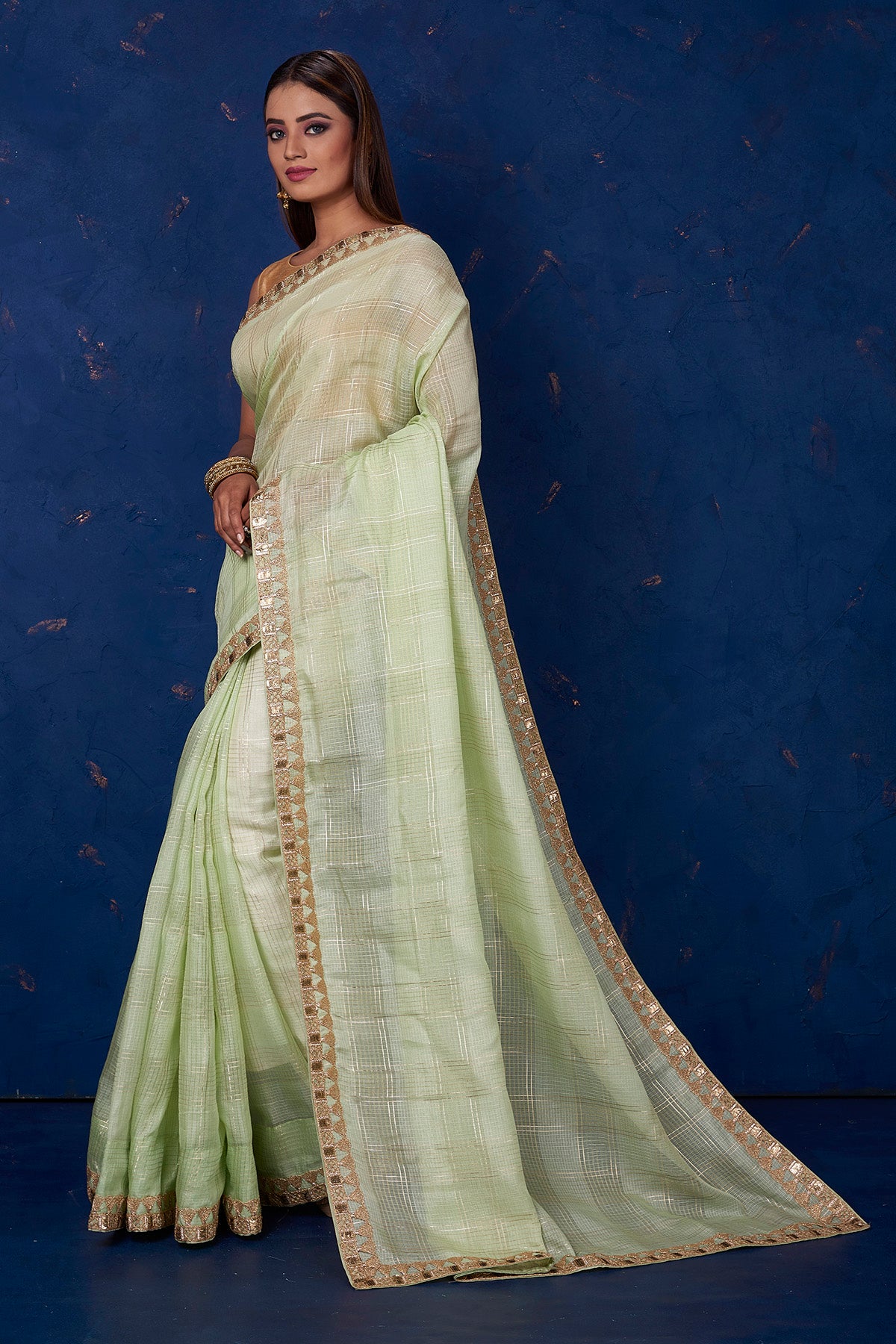Shop beautiful pista green Kota check saree online in USA with embroidered border. Keep your ethnic wardrobe up to date with latest designer sarees, pure silk sarees, handwoven sarees, tussar silk sarees, embroidered sarees from Pure Elegance Indian saree store in USA.-pallu