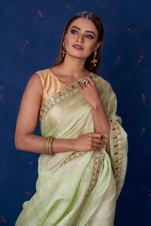 Shop beautiful pista green Kota check saree online in USA with embroidered border. Keep your ethnic wardrobe up to date with latest designer sarees, pure silk sarees, handwoven sarees, tussar silk sarees, embroidered sarees from Pure Elegance Indian saree store in USA.-closeup