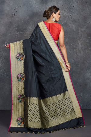 Shop stunning black Katan silk sari online in USA with golden zari border. Keep your ethnic wardrobe up to date with latest designer sarees, pure silk sarees, handwoven sarees, tussar silk sarees, embroidered sarees from Pure Elegance Indian saree store in USA.-back