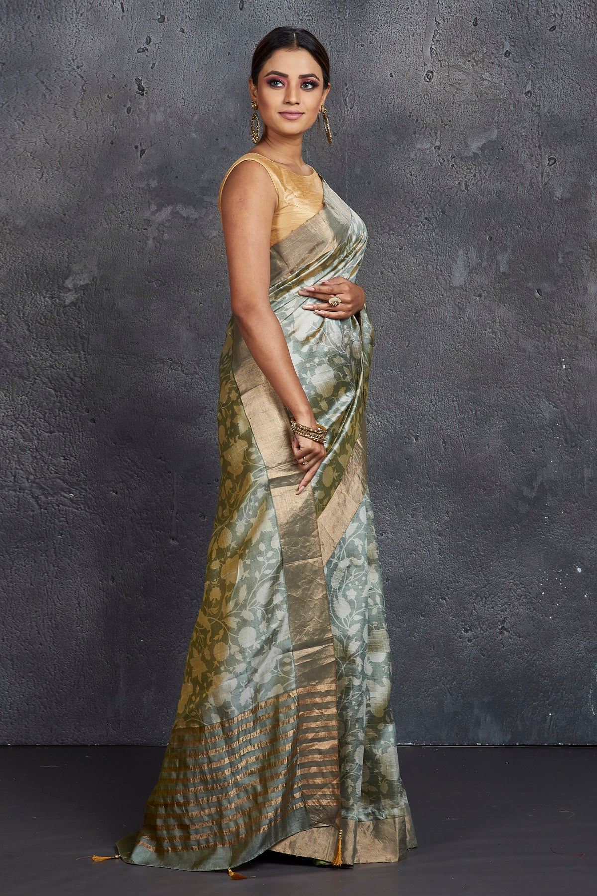 Shop elegant grey printed raw silk saree online in USA. Be the center of attraction at parties and festive occasions in stunning silk sarees, handwoven sarees, embroidered sarees, designer sarees, Banarasi sarees, tussar silk sarees from Pure Elegance Indian fashion store in USA.-side