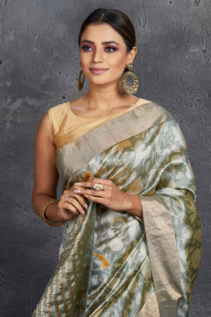 Shop elegant grey printed raw silk saree online in USA. Be the center of attraction at parties and festive occasions in stunning silk sarees, handwoven sarees, embroidered sarees, designer sarees, Banarasi sarees, tussar silk sarees from Pure Elegance Indian fashion store in USA.-closeup