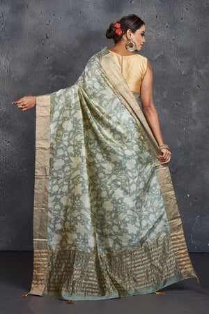 Shop elegant grey printed raw silk saree online in USA. Be the center of attraction at parties and festive occasions in stunning silk sarees, handwoven sarees, embroidered sarees, designer sarees, Banarasi sarees, tussar silk sarees from Pure Elegance Indian fashion store in USA.-back