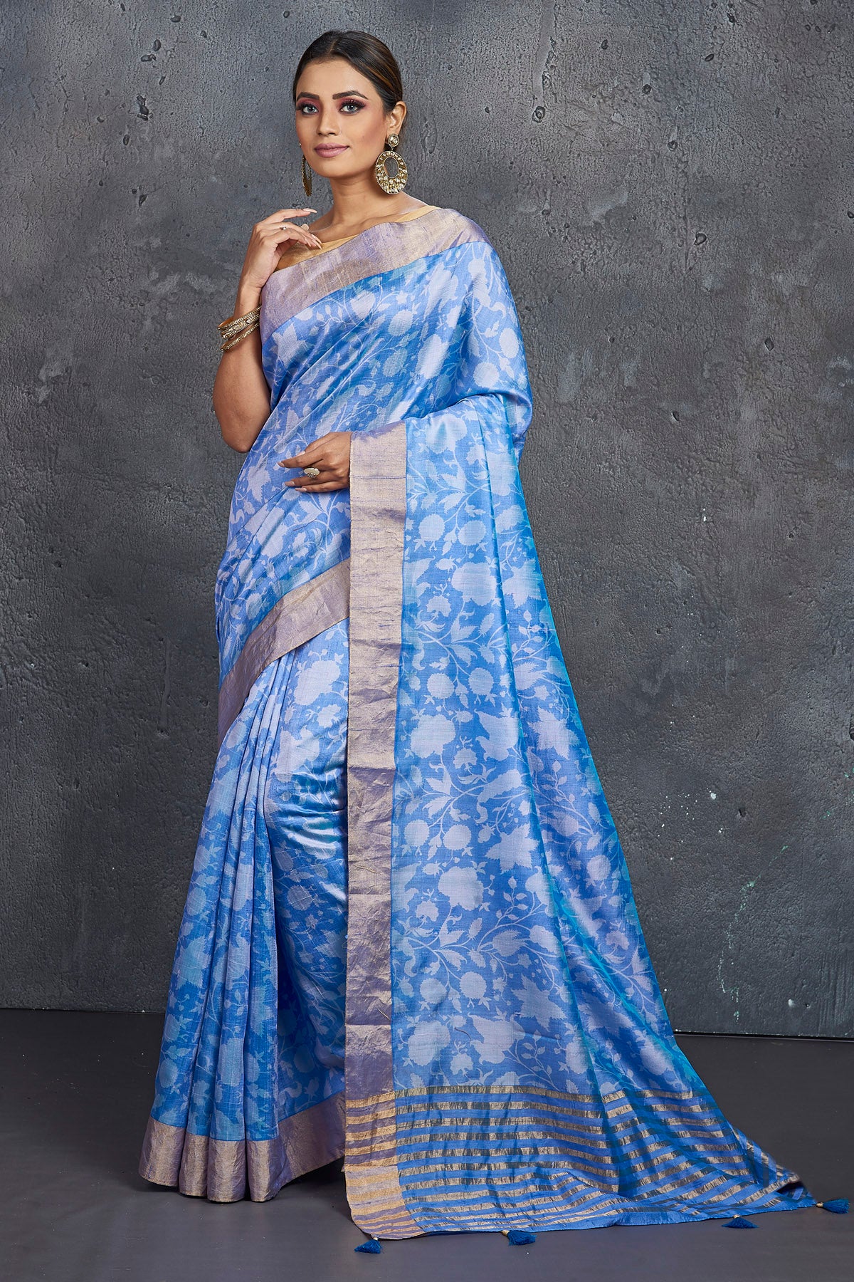 Shop stunning light blue printed raw silk saree online in USA. Be the center of attraction at parties and festive occasions in stunning silk sarees, handwoven sarees, embroidered sarees, designer sarees, Banarasi sarees, tussar silk sarees from Pure Elegance Indian fashion store in USA.-full view