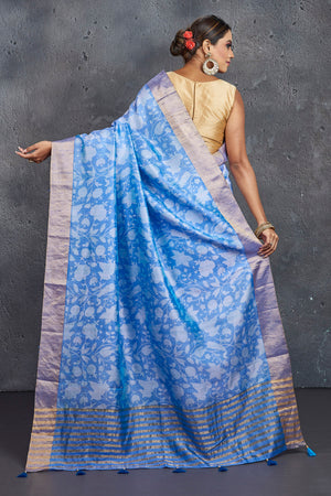 Shop stunning light blue printed raw silk saree online in USA. Be the center of attraction at parties and festive occasions in stunning silk sarees, handwoven sarees, embroidered sarees, designer sarees, Banarasi sarees, tussar silk sarees from Pure Elegance Indian fashion store in USA.-back