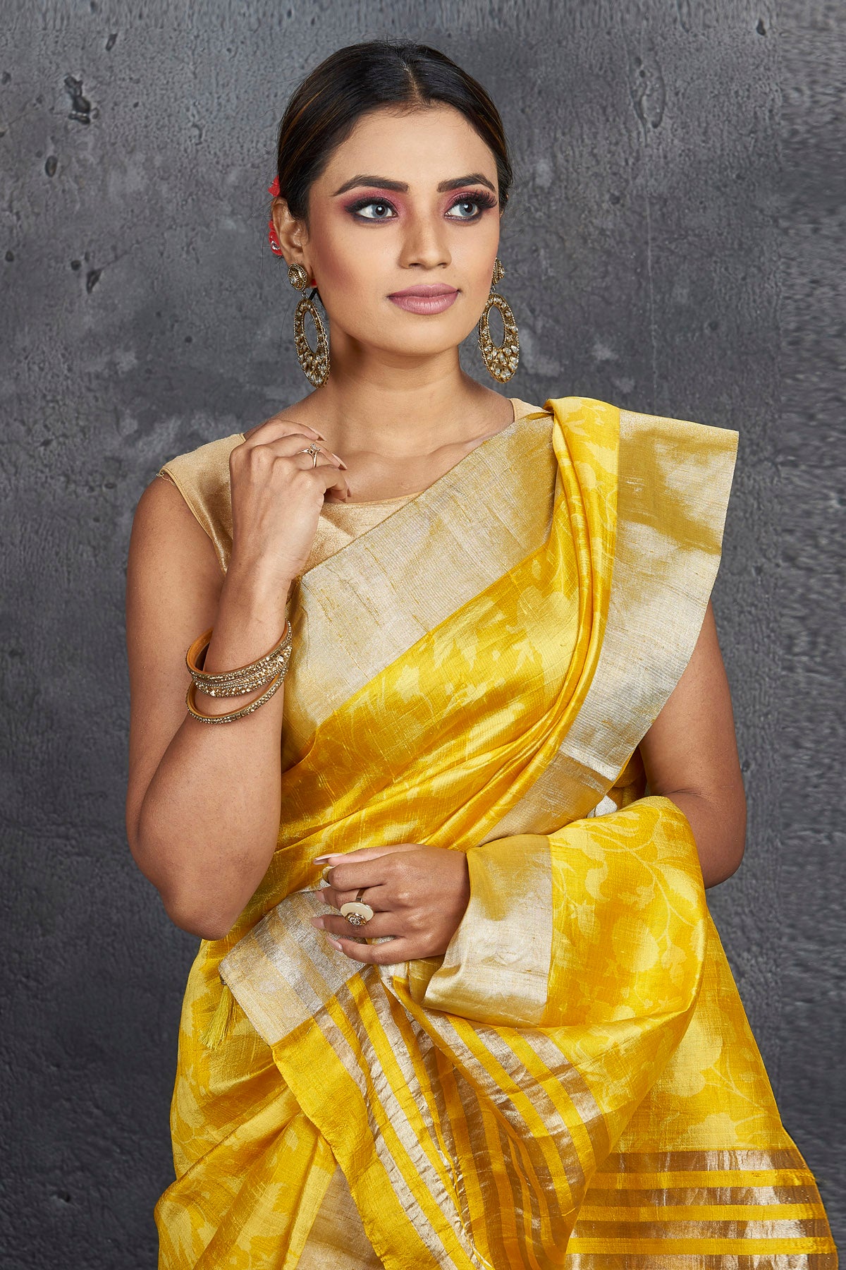 Shop stunning yellow printed printed raw silk sari online in USA with zari border. Be the center of attraction at parties and festive occasions in stunning silk sarees, handwoven sarees, embroidered sarees, designer sarees, Banarasi sarees, tussar silk sarees from Pure Elegance Indian fashion store in USA.-closeup