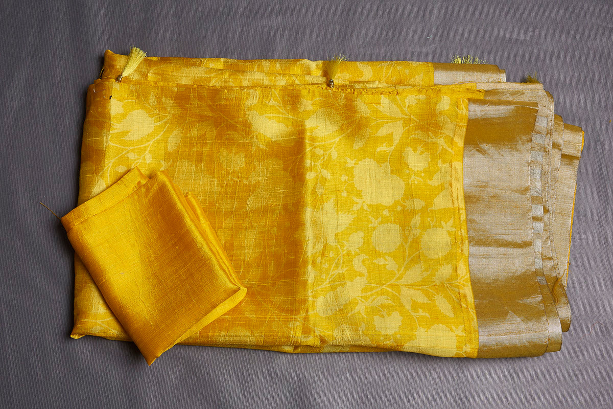 Shop stunning yellow printed printed raw silk sari online in USA with zari border. Be the center of attraction at parties and festive occasions in stunning silk sarees, handwoven sarees, embroidered sarees, designer sarees, Banarasi sarees, tussar silk sarees from Pure Elegance Indian fashion store in USA.-blouse