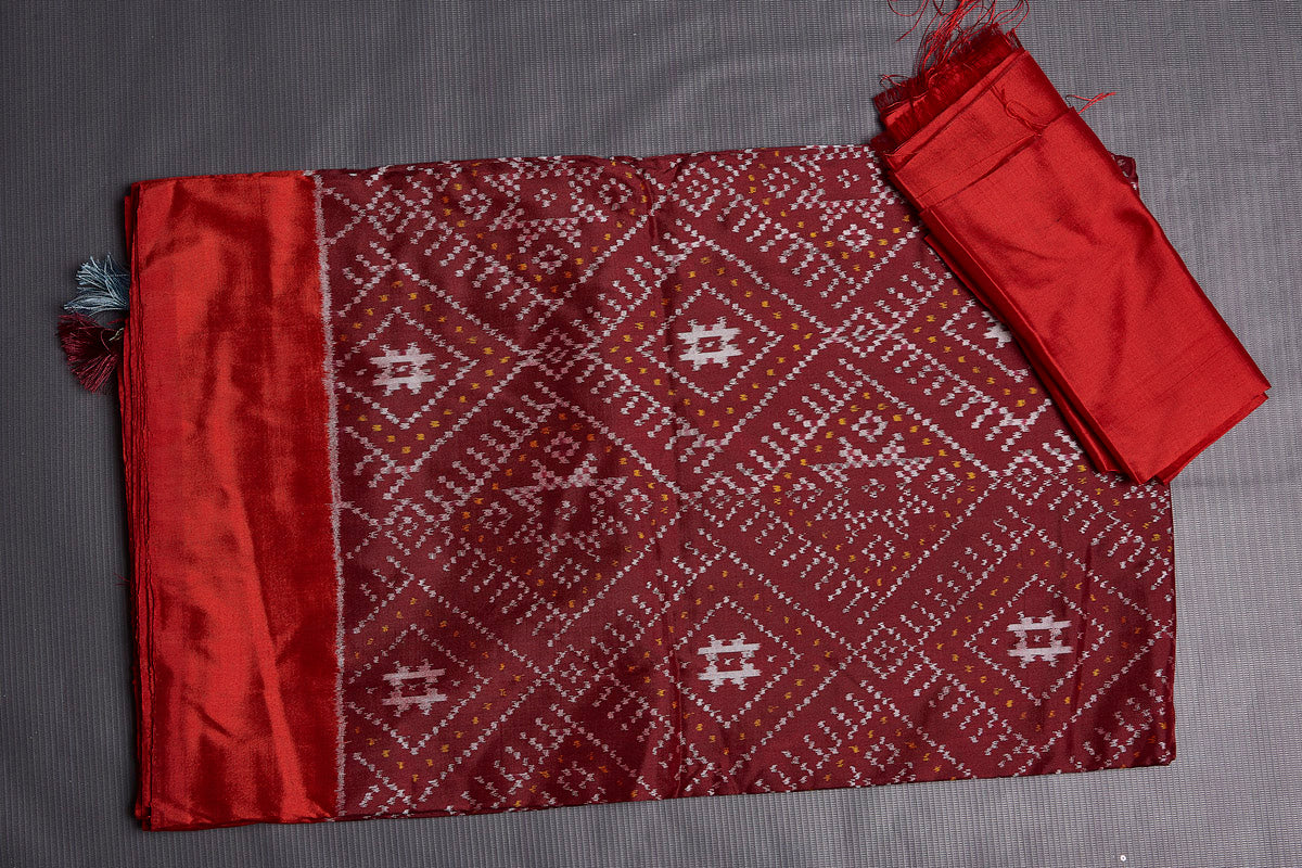 Buy stunning maroon ikkat silk saree online in USA with red border and pallu. Keep your ethnic wardrobe up to date with latest designer sarees, pure silk sarees, handwoven sarees, tussar silk sarees, embroidered saris, Paithani sarees from Pure Elegance Indian saree store in USA.-blouse