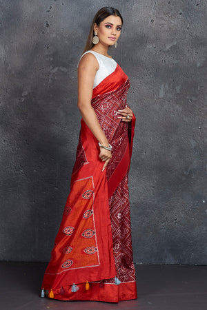 Buy stunning maroon ikkat silk saree online in USA with red border and pallu. Keep your ethnic wardrobe up to date with latest designer sarees, pure silk sarees, handwoven sarees, tussar silk sarees, embroidered saris, Paithani sarees from Pure Elegance Indian saree store in USA.-side