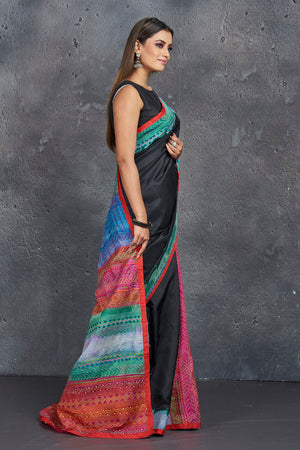 Buy stunning black silk saree online in USA with multicolor Kantha pallu and border. Keep your ethnic wardrobe up to date with latest designer sarees, pure silk sarees, handwoven sarees, tussar silk sarees, embroidered saris, Paithani sarees from Pure Elegance Indian saree store in USA.-side