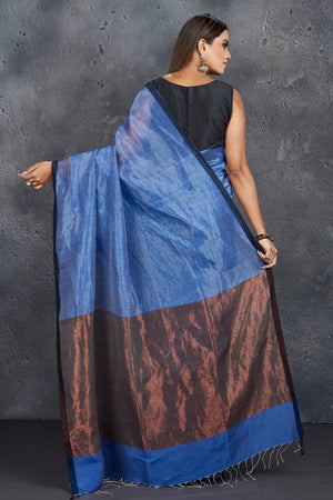 Shop elegant blue silk linen saree online in USA with zari pallu. Keep your ethnic wardrobe up to date with latest designer sarees, pure silk sarees, handwoven sarees, tussar silk sarees, embroidered saris, Paithani sarees from Pure Elegance Indian saree store in USA.-back