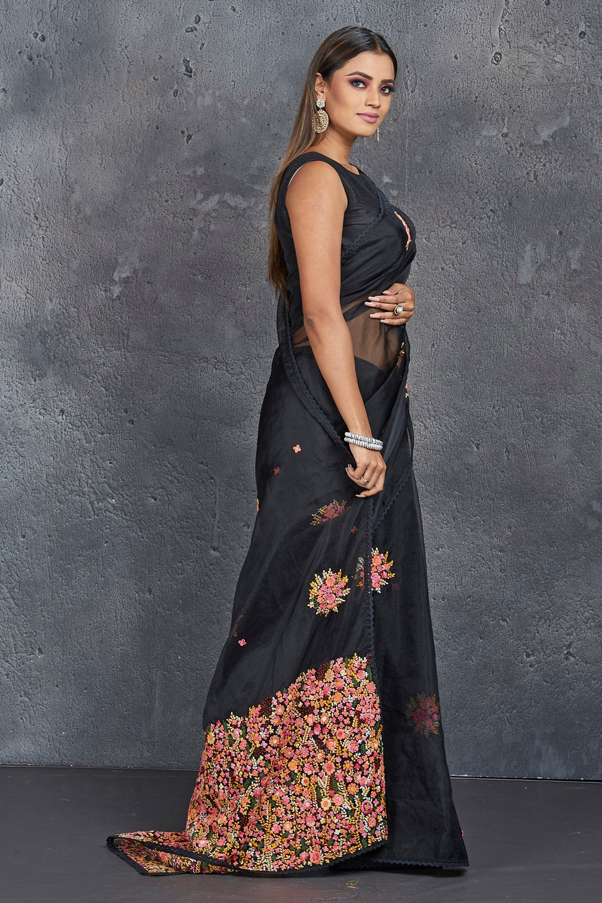 Buy stunning black organza saree online in USA with French knot embroidery. Keep your ethnic wardrobe up to date with latest designer sarees, pure silk sarees, handwoven sarees, tussar silk sarees, embroidered sarees, Paithani sarees from Pure Elegance Indian saree store in USA.-side
