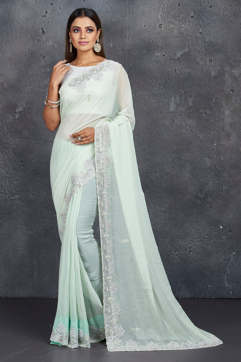 Shop stunning mint green organza saree online in USA with pearl embroidery. Keep your ethnic wardrobe up to date with latest designer sarees, pure silk sarees, handwoven sarees, tussar silk sarees, embroidered sarees, Paithani sarees from Pure Elegance Indian saree store in USA.-full view