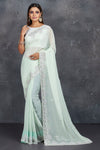 Shop stunning mint green organza saree online in USA with pearl embroidery. Keep your ethnic wardrobe up to date with latest designer sarees, pure silk sarees, handwoven sarees, tussar silk sarees, embroidered sarees, Paithani sarees from Pure Elegance Indian saree store in USA.-full view