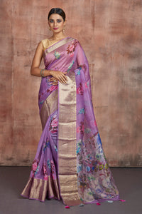Buy beautiful lavender floral organza sari online in USA with zari border. Keep your ethnic wardrobe up to date with latest designer sarees, pure silk sarees, handwoven sarees, tussar silk sarees, embroidered sarees from Pure Elegance Indian saree store in USA.-full view