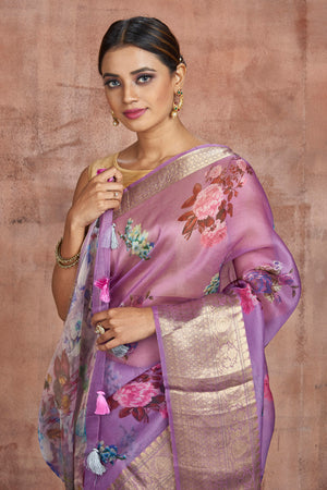 Buy beautiful lavender floral organza sari online in USA with zari border. Keep your ethnic wardrobe up to date with latest designer sarees, pure silk sarees, handwoven sarees, tussar silk sarees, embroidered sarees from Pure Elegance Indian saree store in USA.-closeup