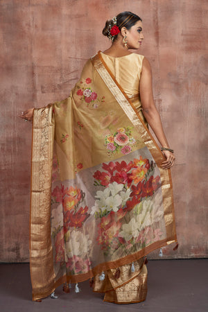 Buy gorgeous beige floral organza saree online in USA with zari border. Keep your ethnic wardrobe up to date with latest designer sarees, pure silk sarees, handwoven sarees, tussar silk sarees, embroidered sarees from Pure Elegance Indian saree store in USA.-back