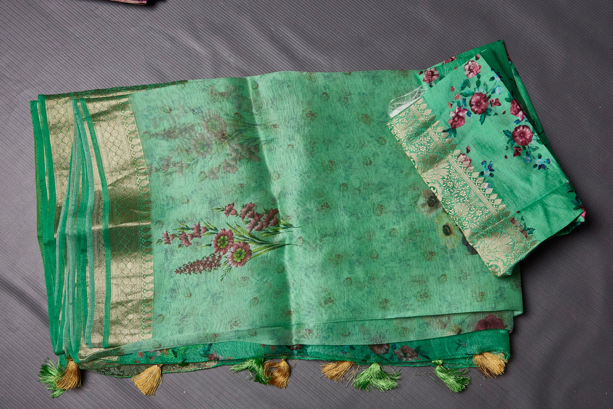 Shop beautiful pastel green floral organza saree online in USA with zari border. Keep your ethnic wardrobe up to date with latest designer sarees, pure silk sarees, handwoven sarees, tussar silk sarees, embroidered sarees from Pure Elegance Indian saree store in USA.-blouse