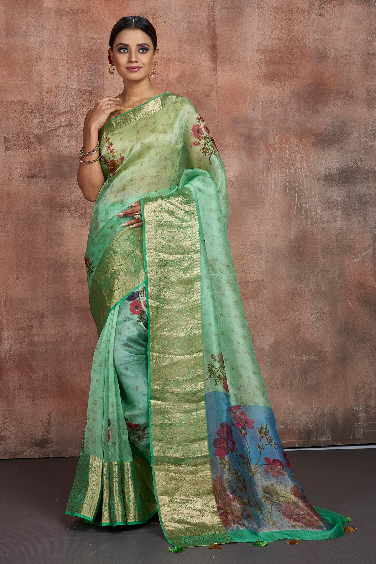 Shop beautiful pastel green floral organza saree online in USA with zari border. Keep your ethnic wardrobe up to date with latest designer sarees, pure silk sarees, handwoven sarees, tussar silk sarees, embroidered sarees from Pure Elegance Indian saree store in USA.-full view