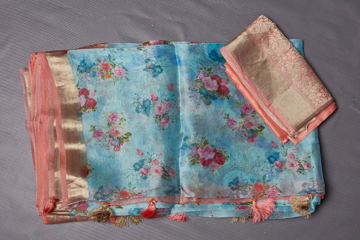 Buy beautiful light blue floral print organza saree online in USA with zari border. Keep your ethnic wardrobe up to date with latest designer sarees, pure silk sarees, handwoven sarees, tussar silk sarees, embroidered sarees from Pure Elegance Indian saree store in USA.-blouse