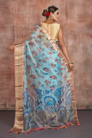 Buy beautiful light blue floral print organza saree online in USA with zari border. Keep your ethnic wardrobe up to date with latest designer sarees, pure silk sarees, handwoven sarees, tussar silk sarees, embroidered sarees from Pure Elegance Indian saree store in USA.-back