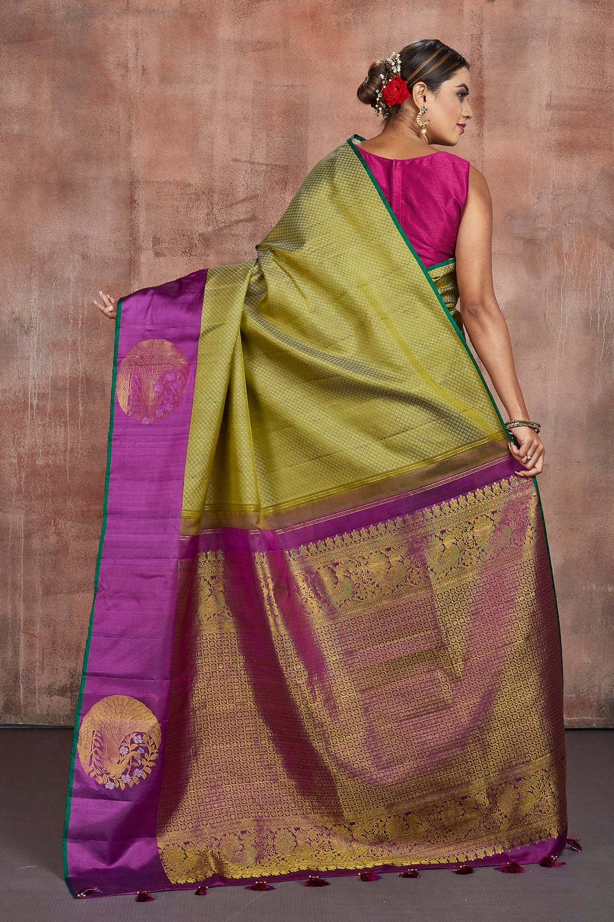 Shop stunning pista green Kanjivaram saree online in USA with purple border with buta. Keep your ethnic wardrobe up to date with latest designer sarees, pure silk sarees, handwoven sarees, tussar silk sarees, embroidered sarees from Pure Elegance Indian saree store in USA.-back