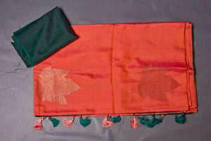 Shop beautiful orange borderless Kanjivaram saree online in USA with dark green zari pallu. Keep your ethnic wardrobe up to date with latest designer sarees, pure silk sarees, handwoven sarees, tussar silk sarees, embroidered sarees from Pure Elegance Indian saree store in USA.-blouse