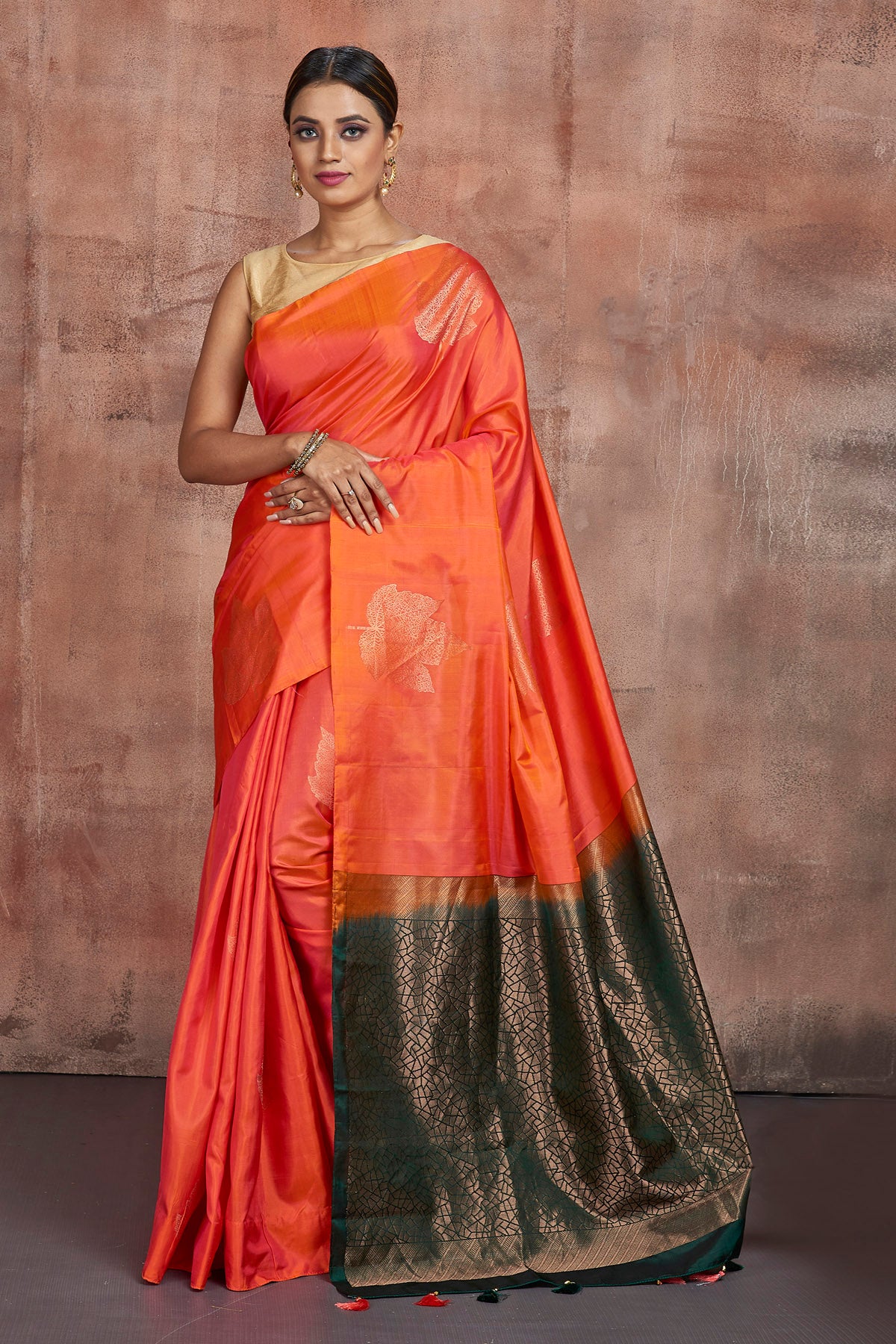 Shop beautiful orange borderless Kanjivaram saree online in USA with dark green zari pallu. Keep your ethnic wardrobe up to date with latest designer sarees, pure silk sarees, handwoven sarees, tussar silk sarees, embroidered sarees from Pure Elegance Indian saree store in USA.-full view
