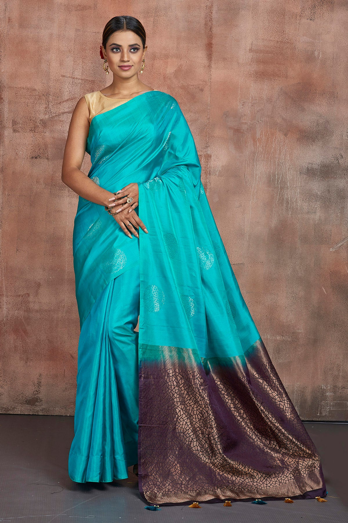 Shop beautiful turquoise blue Kanjivaram saree online in USA with purple zari pallu. Keep your ethnic wardrobe up to date with latest designer sarees, pure silk sarees, handwoven sarees, tussar silk sarees, embroidered sarees from Pure Elegance Indian saree store in USA.-full view