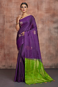 Shop beautiful purple Kanjivaram silk sari online in USA with green zari pallu. Keep your ethnic wardrobe up to date with latest designer sarees, pure silk sarees, handwoven sarees, tussar silk sarees, embroidered sarees from Pure Elegance Indian saree store in USA.-full view