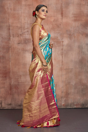 Buy beautiful pastel blue Kanjivaram silk saree online in USA with golden zari border. Keep your ethnic wardrobe up to date with latest designer sarees, pure silk sarees, handwoven sarees, tussar silk sarees, embroidered sarees from Pure Elegance Indian saree store in USA.-side