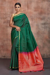 Shop stunning dark green Kanjivaram silk saree online in USA with pink zari pallu. Keep your ethnic wardrobe up to date with latest designer sarees, pure silk sarees, handwoven sarees, tussar silk sarees, embroidered sarees from Pure Elegance Indian saree store in USA.-full view
