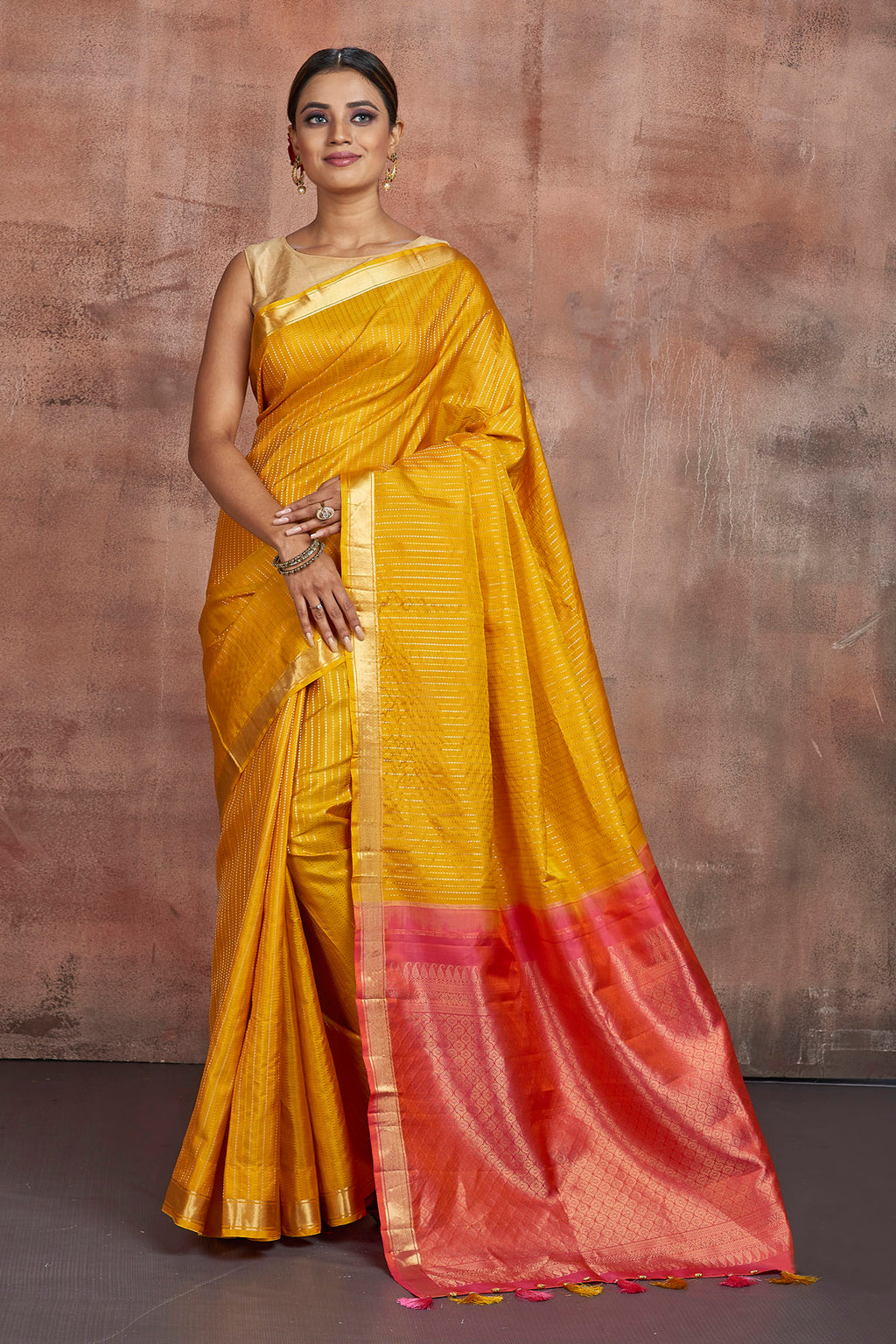 Shop beautiful mustard Kanjivaram silk sari online in USA with pink zari pallu. Keep your ethnic wardrobe up to date with latest designer sarees, pure silk sarees, handwoven sarees, tussar silk sarees, embroidered sarees from Pure Elegance Indian saree store in USA.-full view