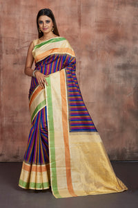 Buy stunning purple and blue stripes Kanjeevaram sari online in USA with cream border. Keep your ethnic wardrobe up to date with latest designer sarees, pure silk sarees, handwoven sarees, tussar silk sarees, embroidered sarees from Pure Elegance Indian saree store in USA.-full view