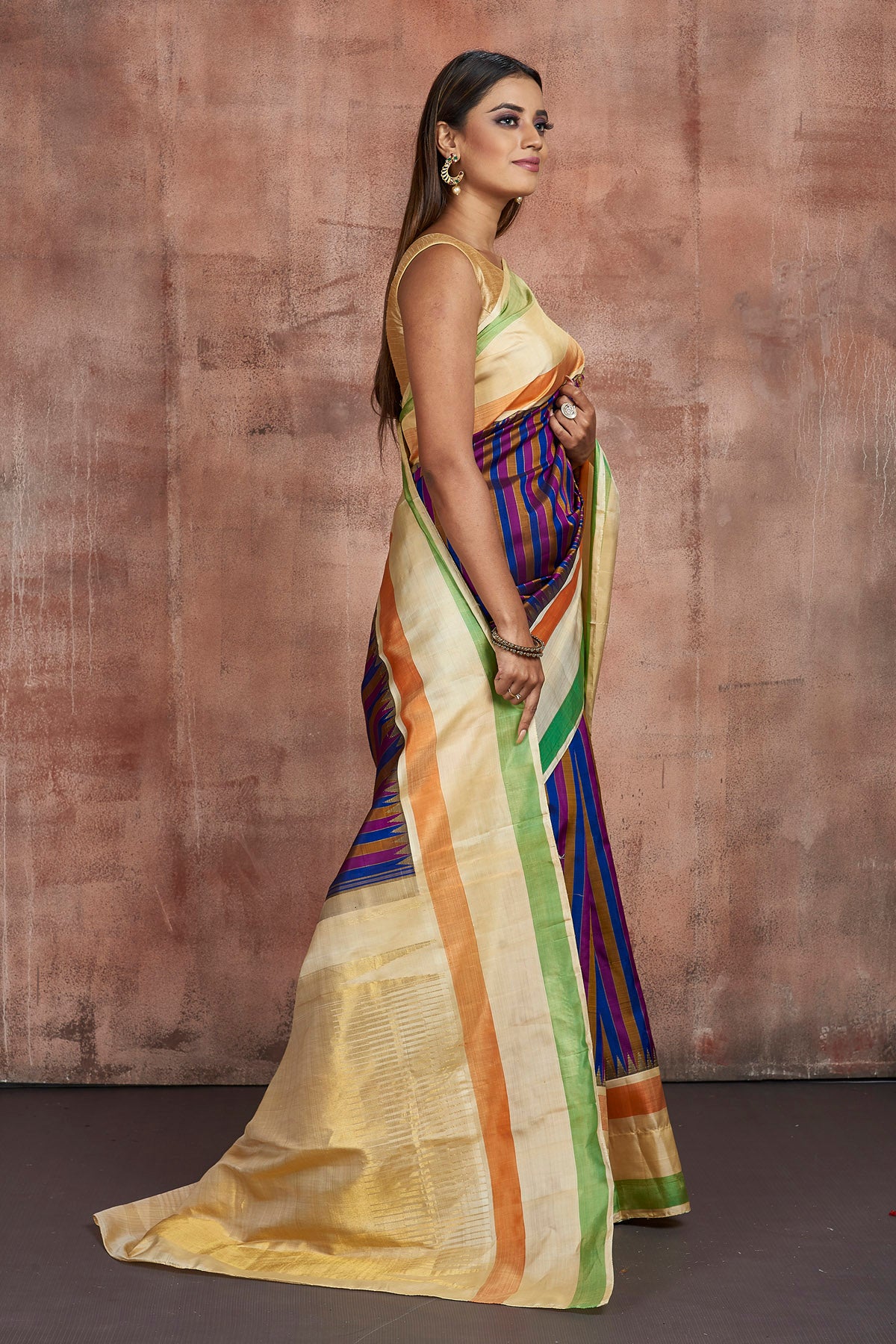 Buy stunning purple and blue stripes Kanjivaram silk sari online in USA with cream border and zari pallu. Keep your ethnic wardrobe up to date with latest Kanchipuram sarees, pure silk sarees, handwoven sarees, tussar silk sarees, embroidered sarees from Pure Elegance Indian saree store in USA.-side