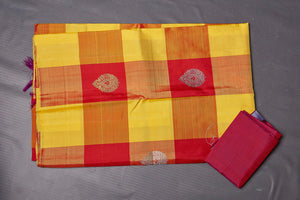 Shop yellow and red check Kanjeevaram saree online in USA with zari pallu. Keep your ethnic wardrobe up to date with latest designer sarees, pure silk sarees, handwoven sarees, tussar silk sarees, embroidered sarees from Pure Elegance Indian saree store in USA.-blouse