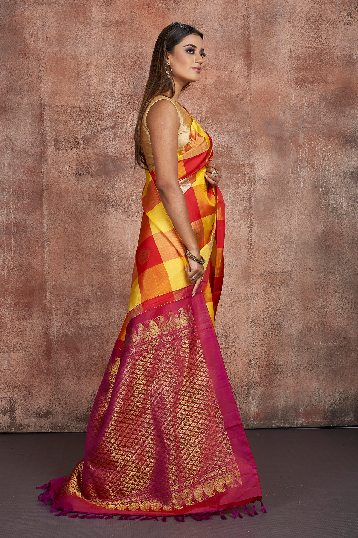 Shop yellow and red check Kanjeevaram saree online in USA with zari pallu. Keep your ethnic wardrobe up to date with latest designer sarees, pure silk sarees, handwoven sarees, tussar silk sarees, embroidered sarees from Pure Elegance Indian saree store in USA.-side
