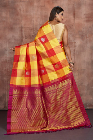 Shop yellow and red check Kanjeevaram saree online in USA with zari pallu. Keep your ethnic wardrobe up to date with latest designer sarees, pure silk sarees, handwoven sarees, tussar silk sarees, embroidered sarees from Pure Elegance Indian saree store in USA.-back