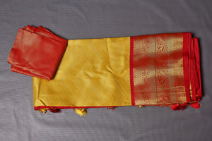 Shop stunning yellow Kanjeevaram silk saree online in USA with red zari border. Keep your ethnic wardrobe up to date with latest designer sarees, pure silk sarees, Kanchipuram silk sarees, handwoven sarees, tussar silk sarees, embroidered sarees from Pure Elegance Indian saree store in USA.-blouse