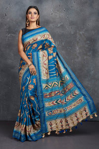 Shop stunning blue pen Kalamkari saree online in USA with blue border. Keep your ethnic wardrobe up to date with latest designer sarees, pure silk sarees, Kanchipuram silk sarees, handwoven sarees, tussar silk sarees, embroidered sarees from Pure Elegance Indian saree store in USA.-full view